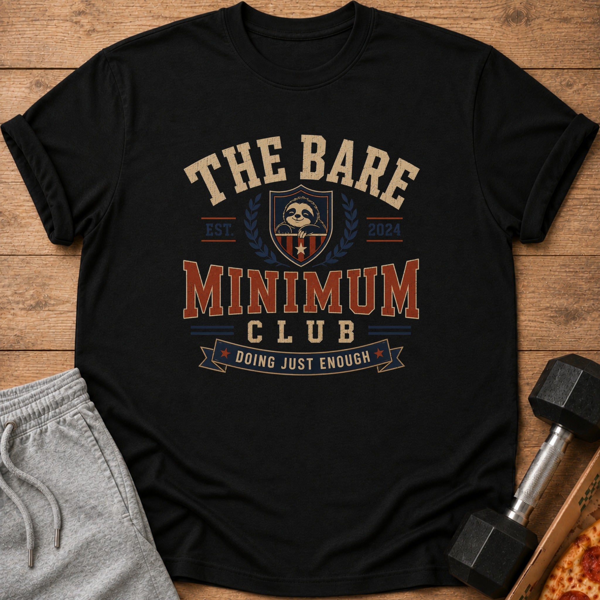 Black t-shirt with "The Bare Minimum Club Doing Just Enough" text and sloth graphic.