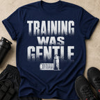 Navy t-shirt with distressed white text "TRAINING WAS GENTLE" and gym accessories.