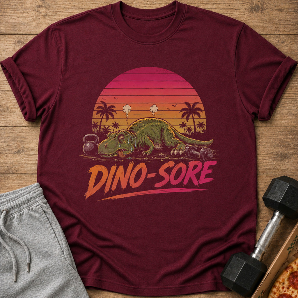 Maroon t-shirt with a tired dinosaur and the text "Dino-Sore".