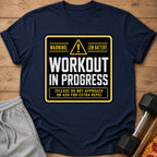 Dark navy t-shirt with "Workout In Progress: Low Battery" text and warning symbol.