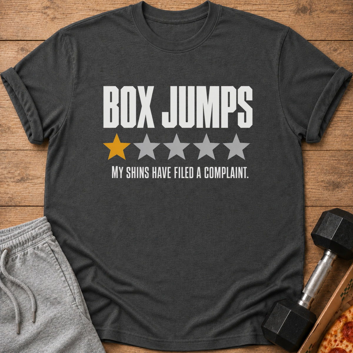 Dark t-shirt with "BOX JUMPS" and one yellow star with four grey stars.