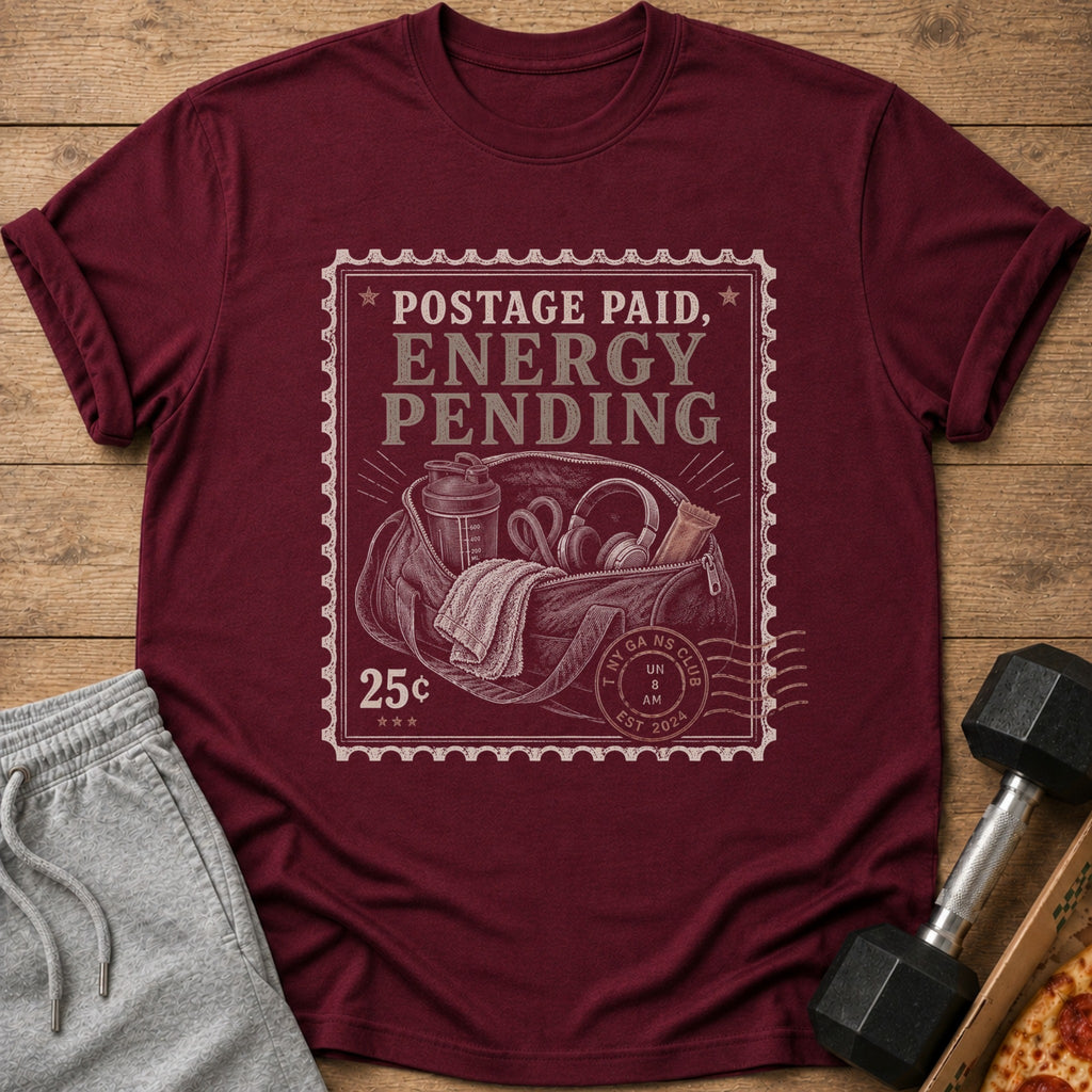 Maroon t-shirt with stamp graphic: "Postage Paid, Energy Pending".