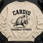 Beige sweatshirt with distressed graphic of a sweating possum running with coffee, text above and below.