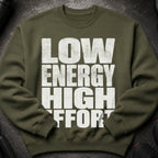 Olive green sweatshirt with white distressed text "LOW ENERGY HIGH EFFORT".