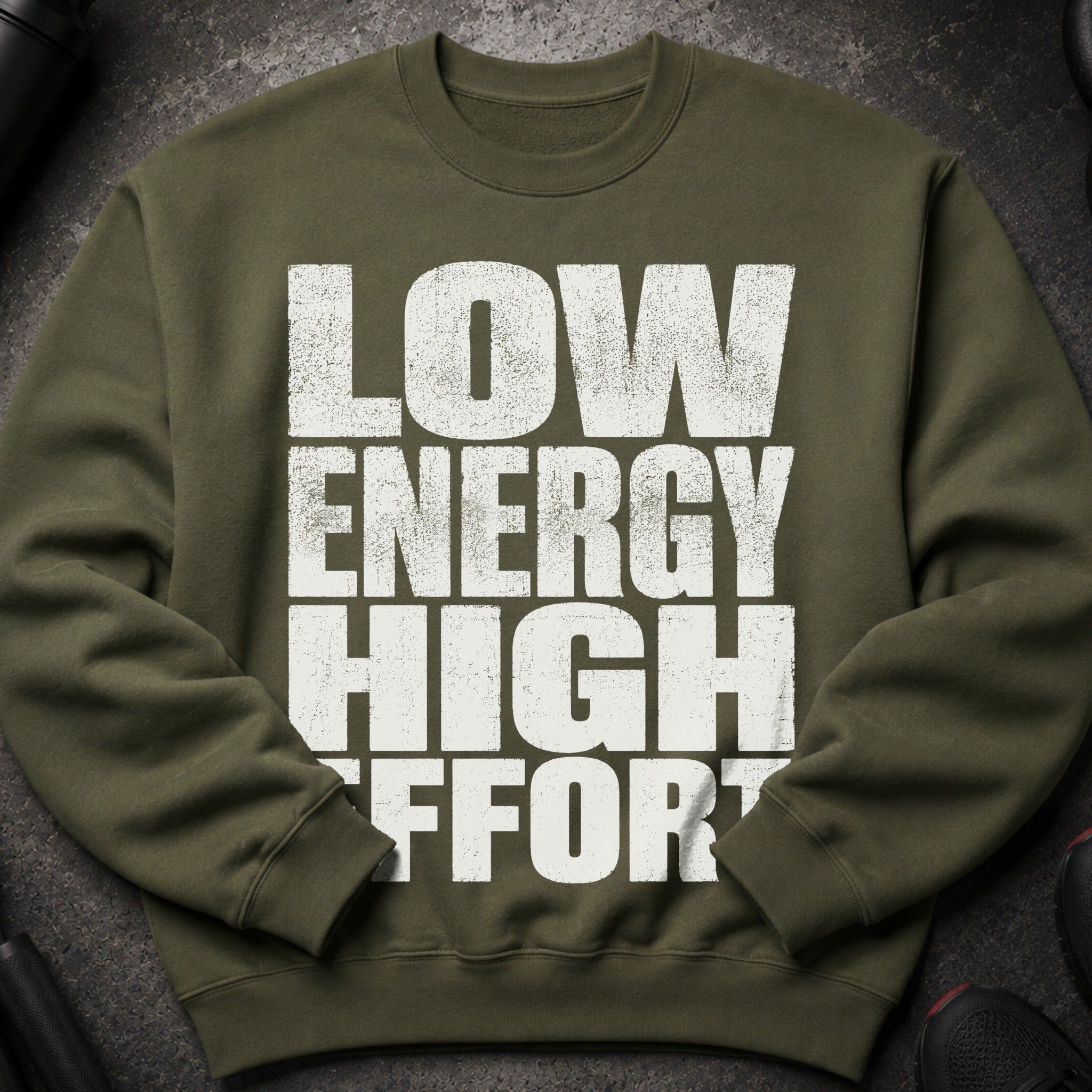 Olive green sweatshirt with white distressed text "LOW ENERGY HIGH EFFORT".