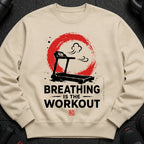 Cream sweatshirt with treadmill graphic and text "BREATHING IS THE WORKOUT".