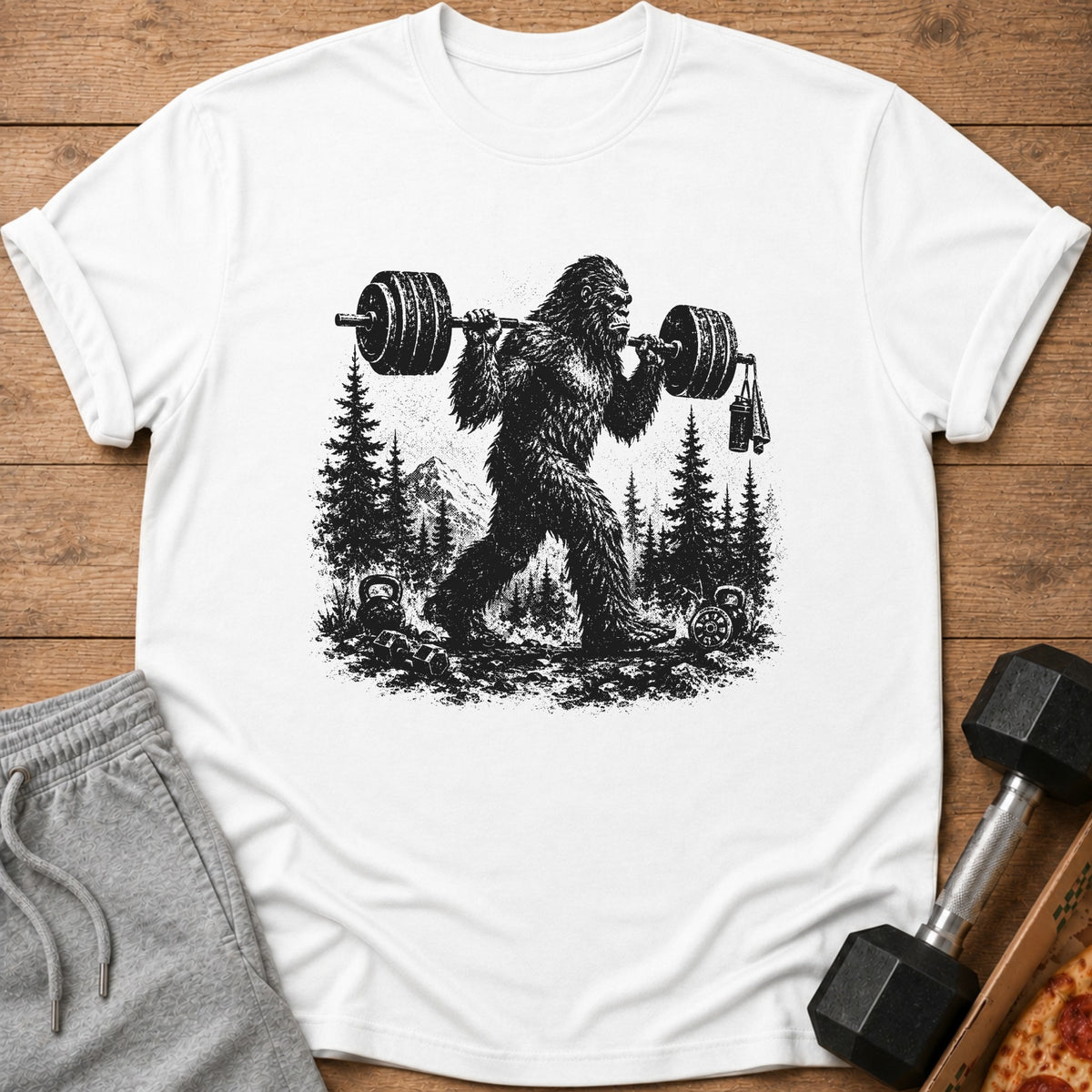 Bigfoot lifting weights in a forest with pine trees and mountains.