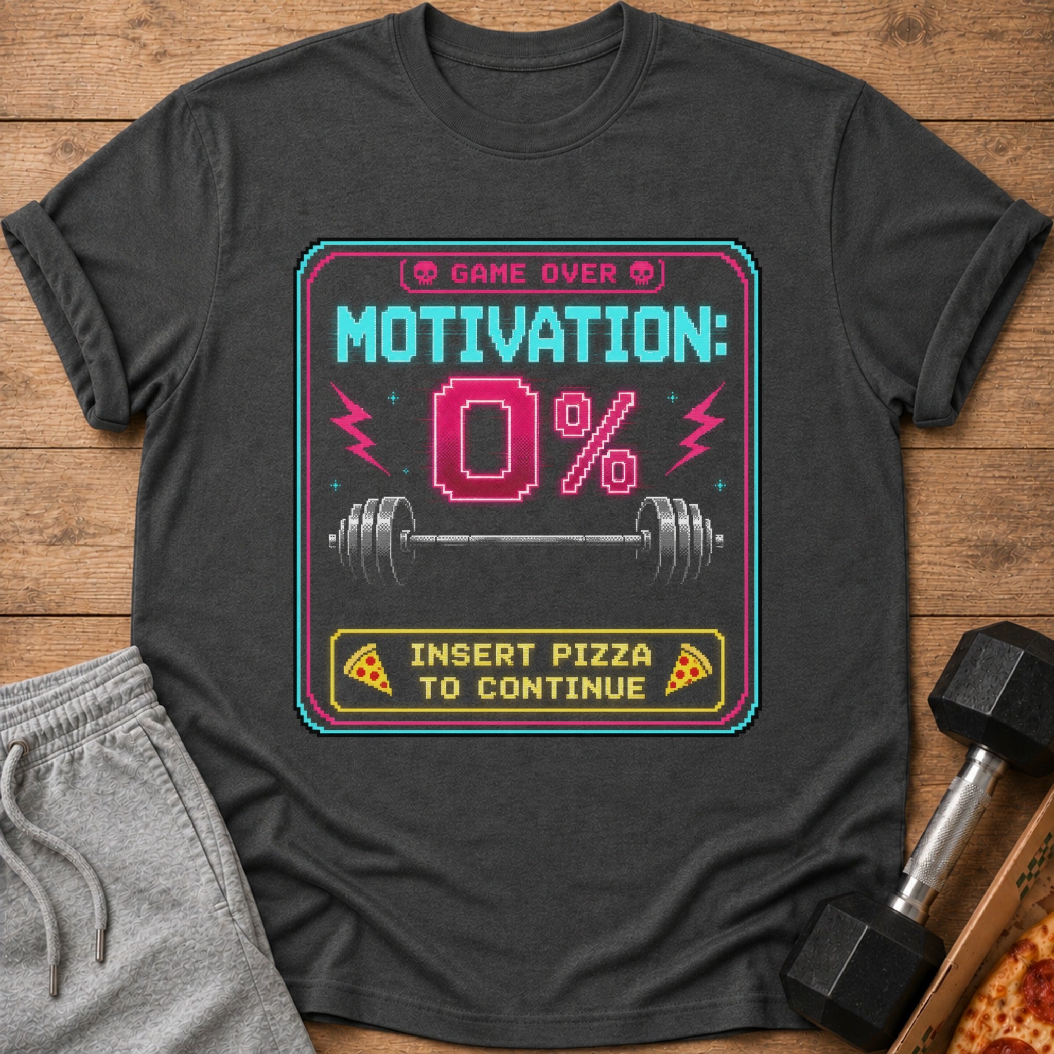 Dark gray t-shirt with pixelated "Game Over Motivation 0%" and "Insert Pizza to Continue".