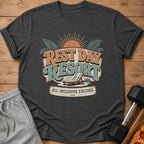 Dark t-shirt with "Rest Day Resort All Inclusive Excuses" graphic and beach chair.