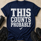 Navy t-shirt with white text reading "THIS COUNTS PROBABLY" and a checkmark.