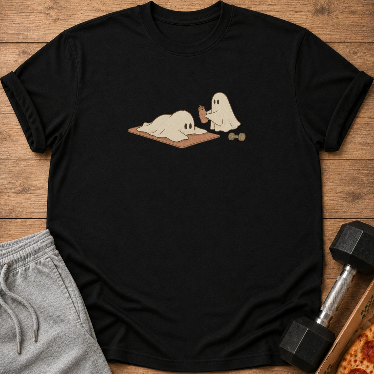 Two cartoon ghosts are shown, one on a yoga mat with a drink, and another with a dumbbell.