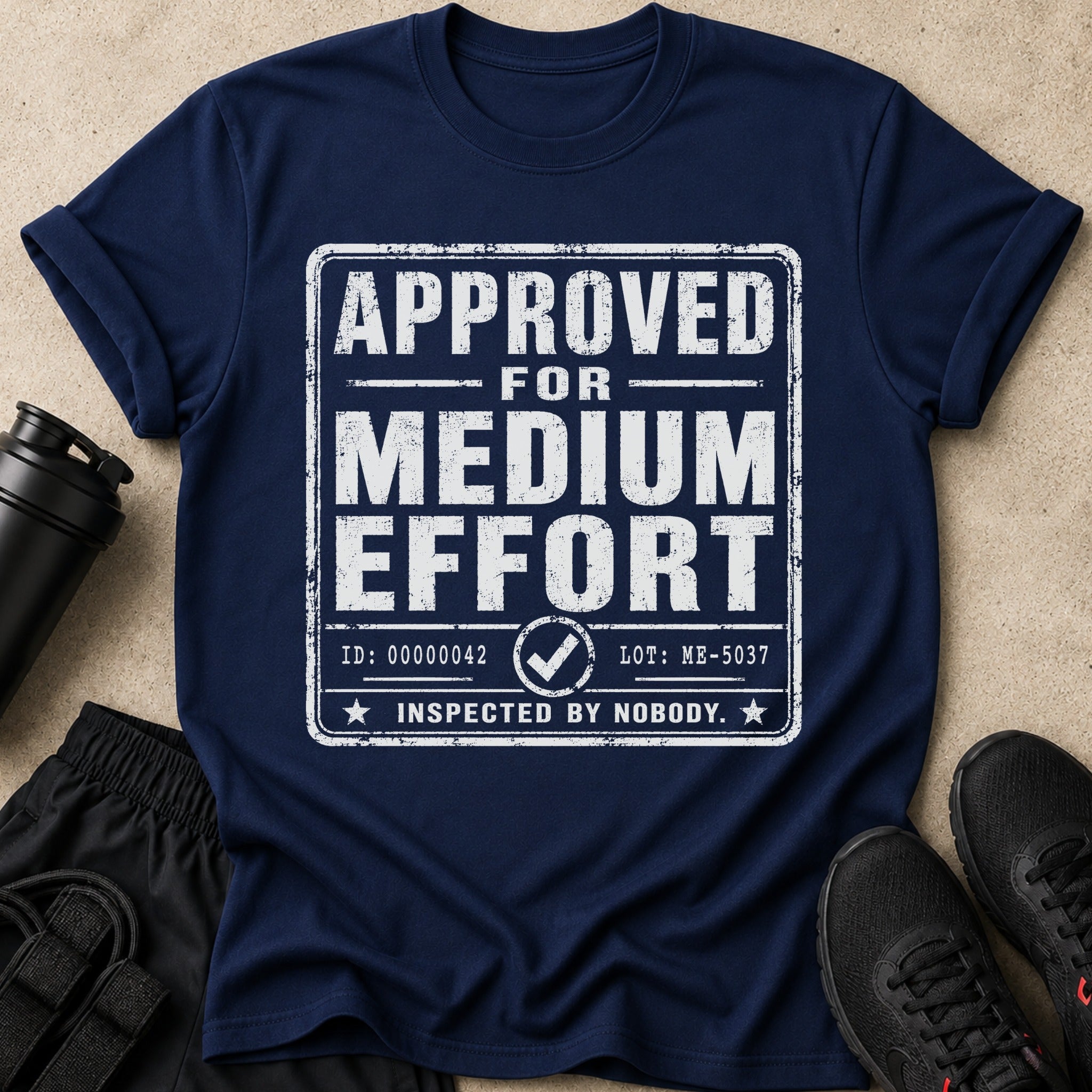 Navy t-shirt with white text: APPROVED FOR MEDIUM EFFORT INSPECTED BY NOBODY