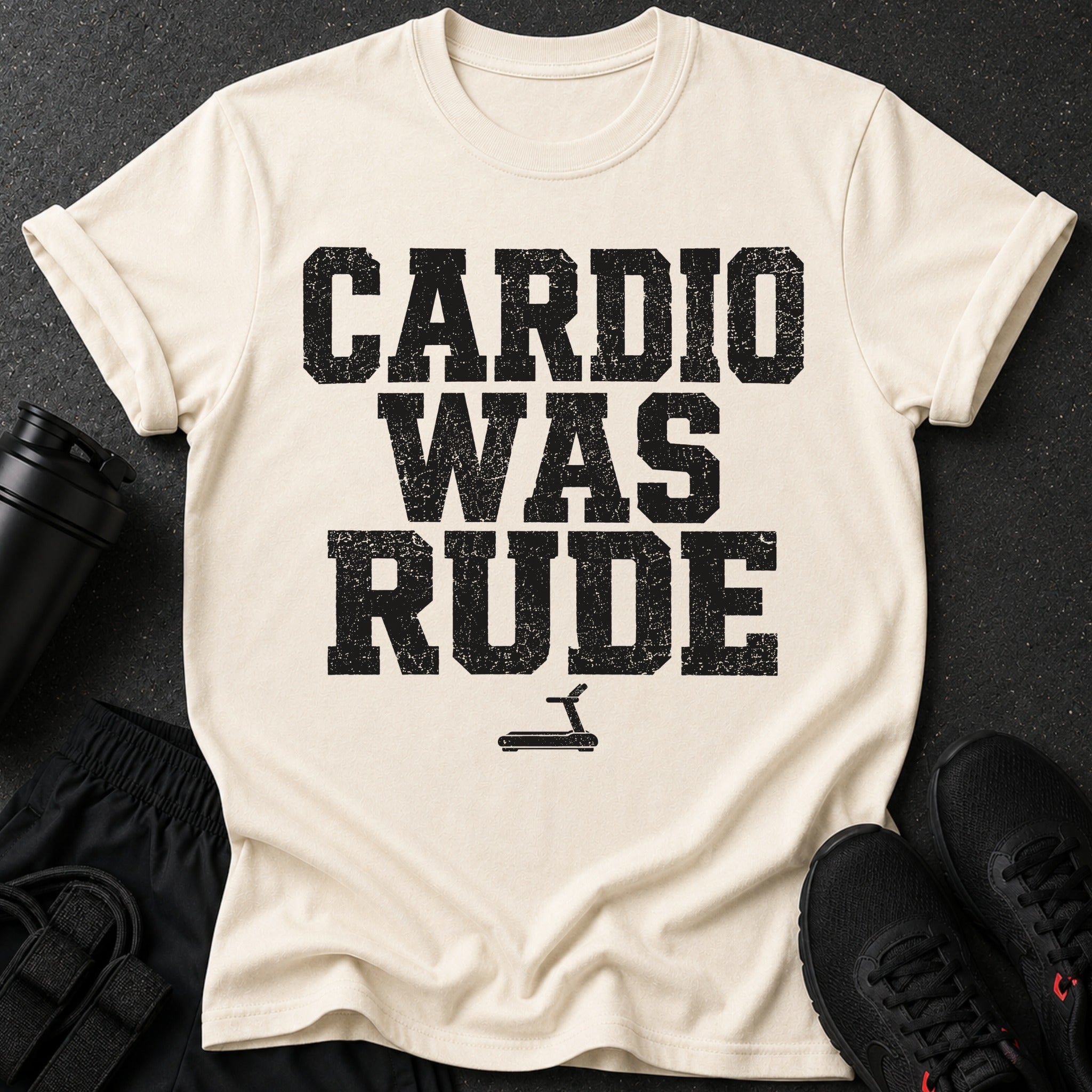 Cream t-shirt with black distressed text "CARDIO WAS RUDE" and a treadmill icon.