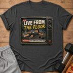 Graphic t-shirt with "LIVE FROM THE FLOOR" text and cartoon of exhausted person on gym floor.