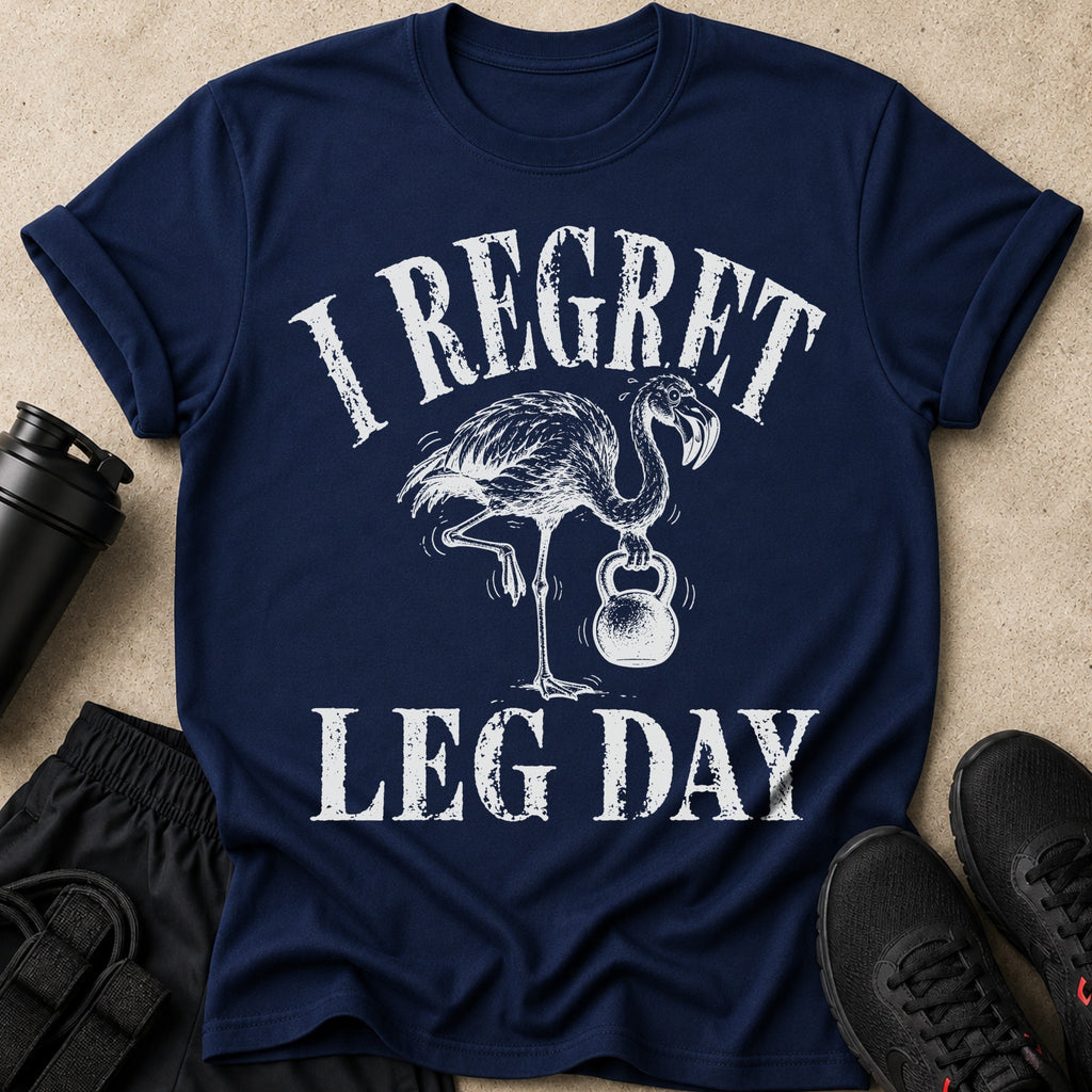 Navy t-shirt with distressed print of a flamingo lifting a kettlebell and text "I Regret Leg Day".