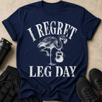 Navy t-shirt with distressed print of a flamingo lifting a kettlebell and text "I Regret Leg Day".