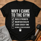 Black t-shirt listing gym goals: build strength, maintain health, earn couch time, become fitness influencer.