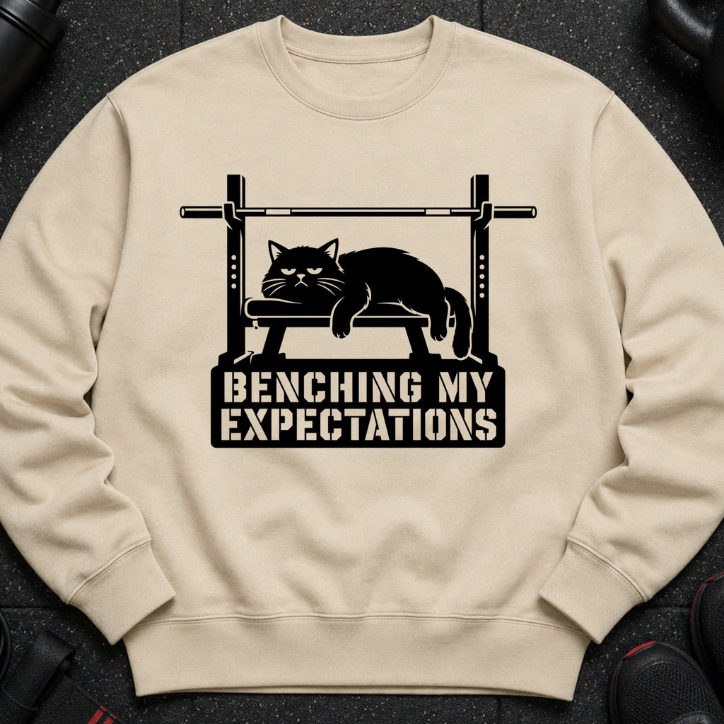 Black cat on weight bench graphic with text "BENCHING MY EXPECTATIONS".