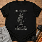 Black t-shirt with skeleton graphic and text "I'm Just Here To Keep The Streak Alive".