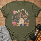 Green t-shirt with "Haunted by Leg Day" text and a sad ghost lifting weights.