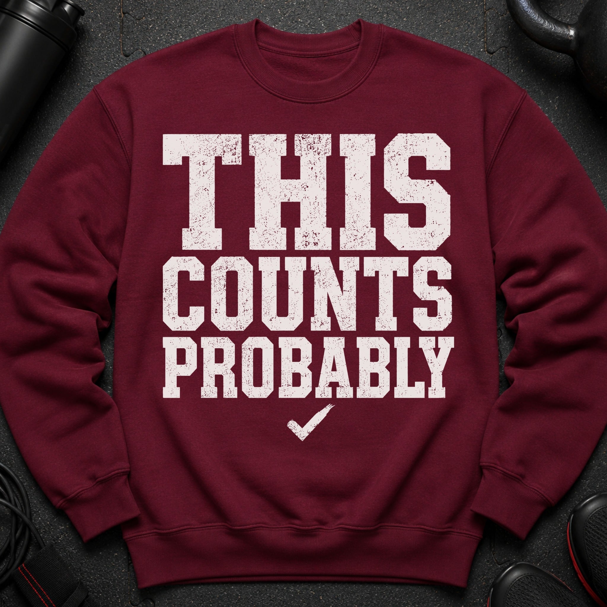 Maroon sweatshirt with distressed white text "THIS COUNTS PROBABLY" and a checkmark.