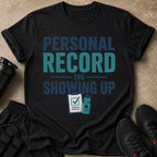 Black t-shirt with 'PERSONAL RECORD IN SHOWING UP' text and workout graphics.
