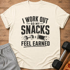 Cream t-shirt with black text "I WORK OUT SO MY SNACKS FEEL EARNED".