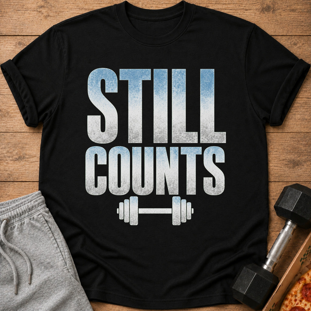 Black t-shirt with "STILL COUNTS" text and dumbbell graphic.