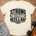 Cream t-shirt with black text "STRONG ENOUGH TO NEED A NAP".
