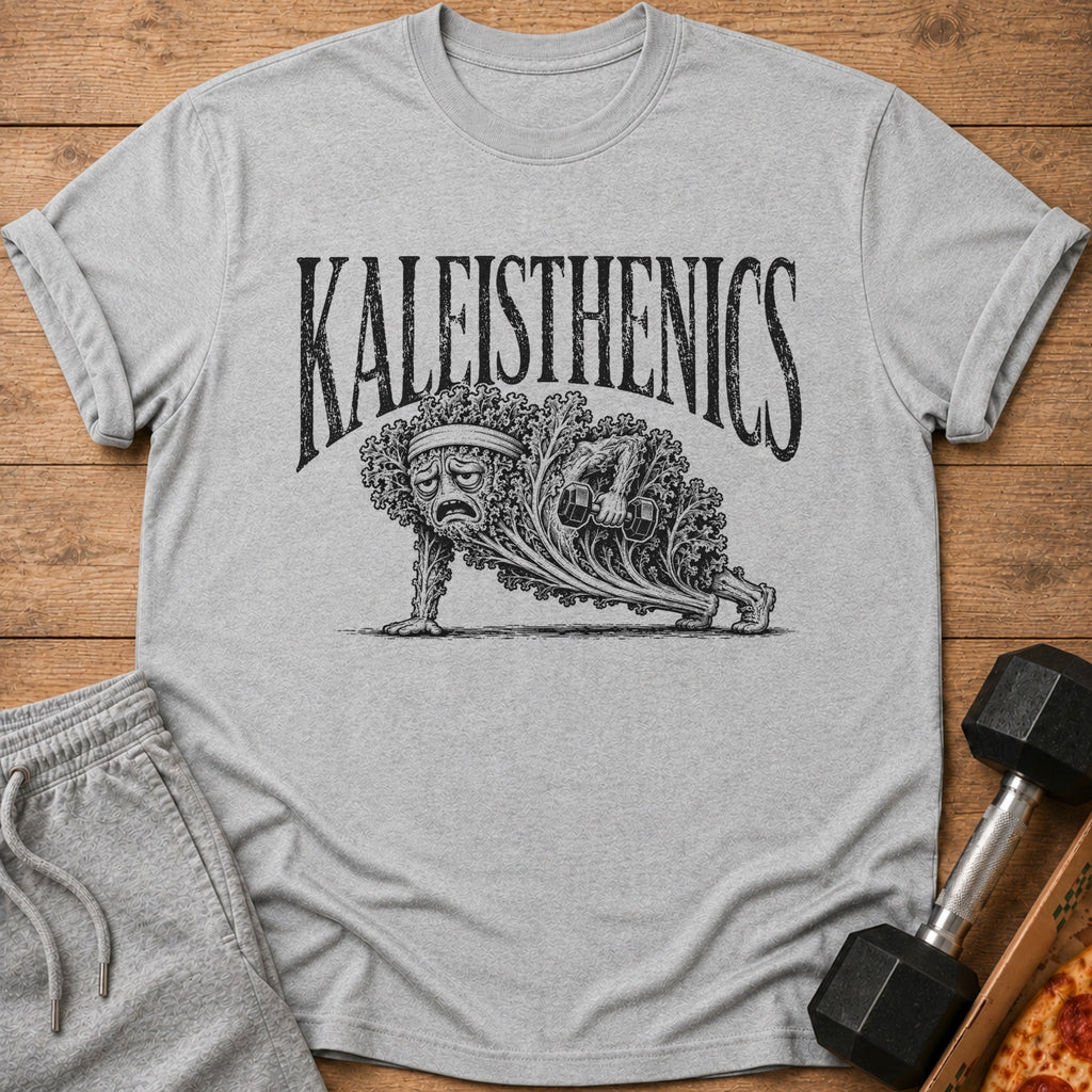 Grey t-shirt with "KALEISTHENICS" text and illustration of sad kale doing push-ups with dumbbells.