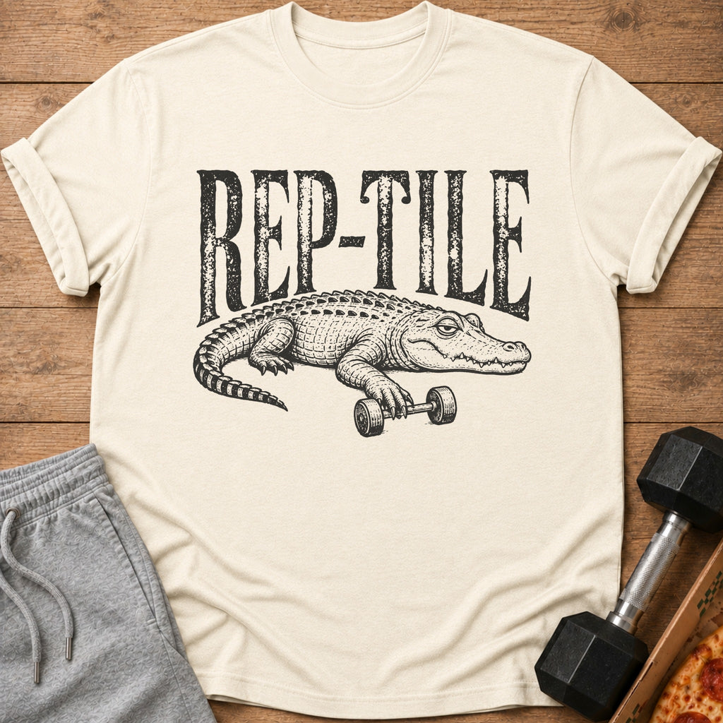 Cream t-shirt with black graphic of alligator lifting dumbbell and text "REP-TILE".