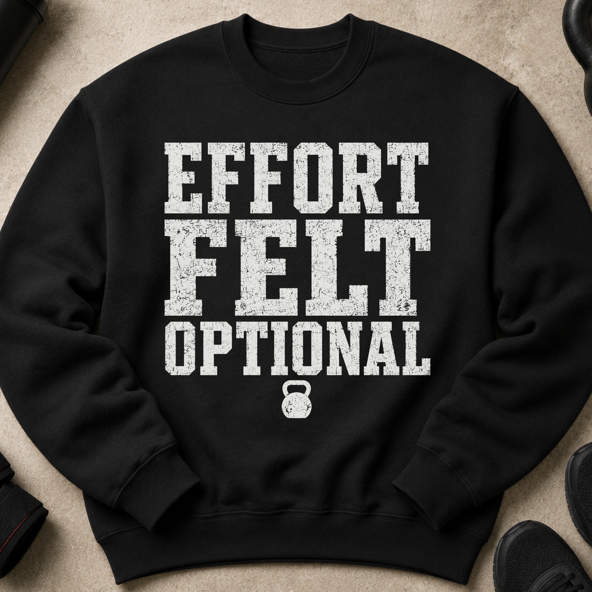 Black sweatshirt with distressed white text, "EFFORT FELT OPTIONAL" and a kettlebell.