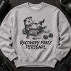 Gray sweatshirt with a humorous opossum graphic and text "RECOVERY FEELS PERSONAL".