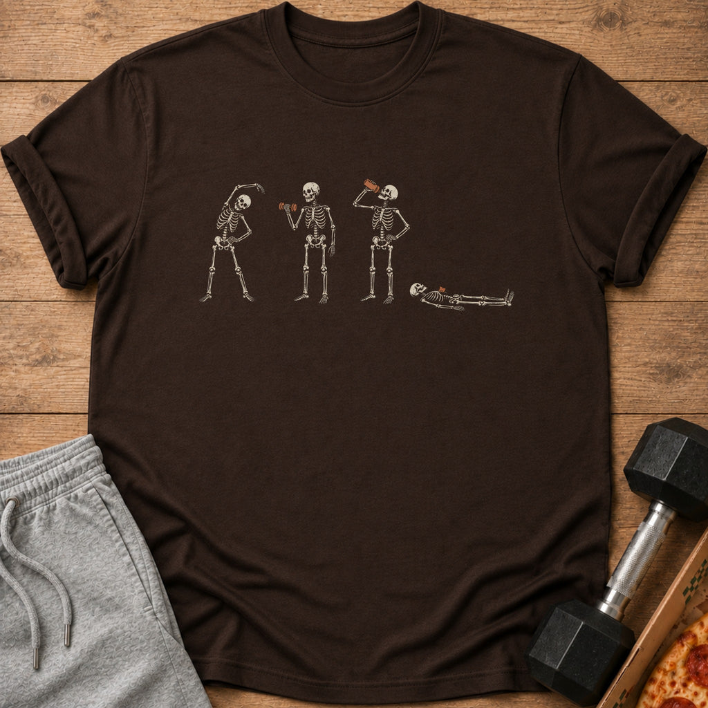 Dark brown t-shirt with four skeletons: stretching, lifting weights, drinking, and resting.