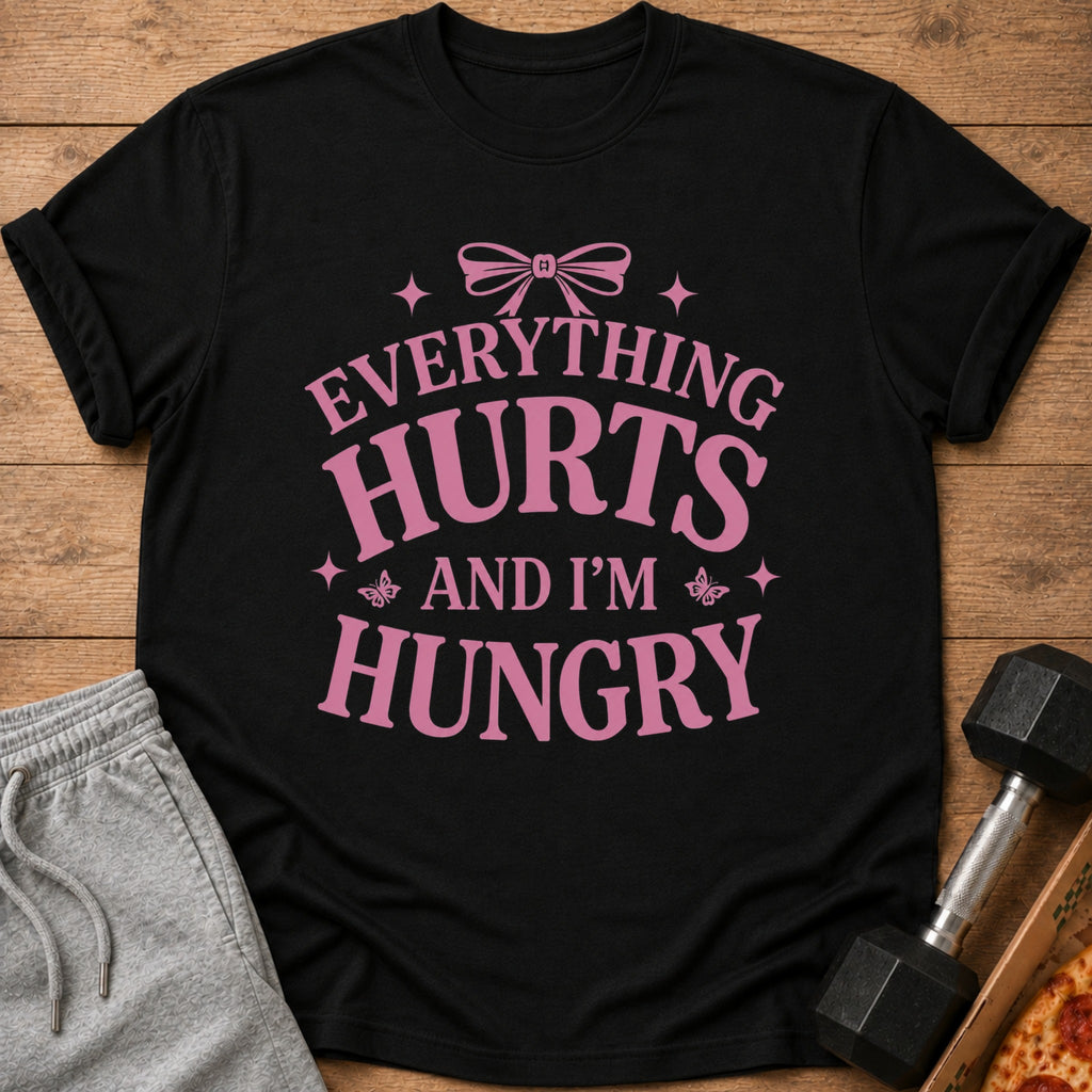 Black t-shirt with pink text that reads "Everything Hurts and I'm Hungry".