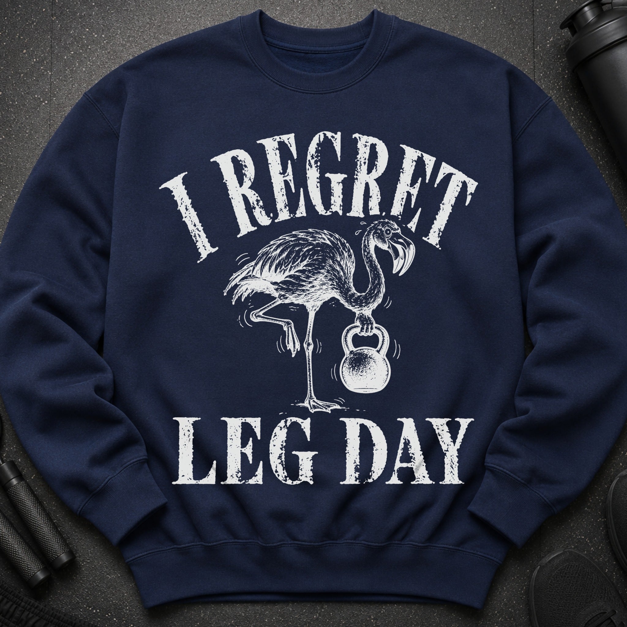 Navy sweatshirt with distressed print: Flamingo holding kettlebell, "I Regret Leg Day".