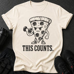 Cream t-shirt with cartoon pizza lifting dumbbell and text "THIS COUNTS."