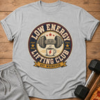 Grey t-shirt with "Low Energy Lifting Club Est. Whenever" graphic featuring a tired dumbbell and coffee.