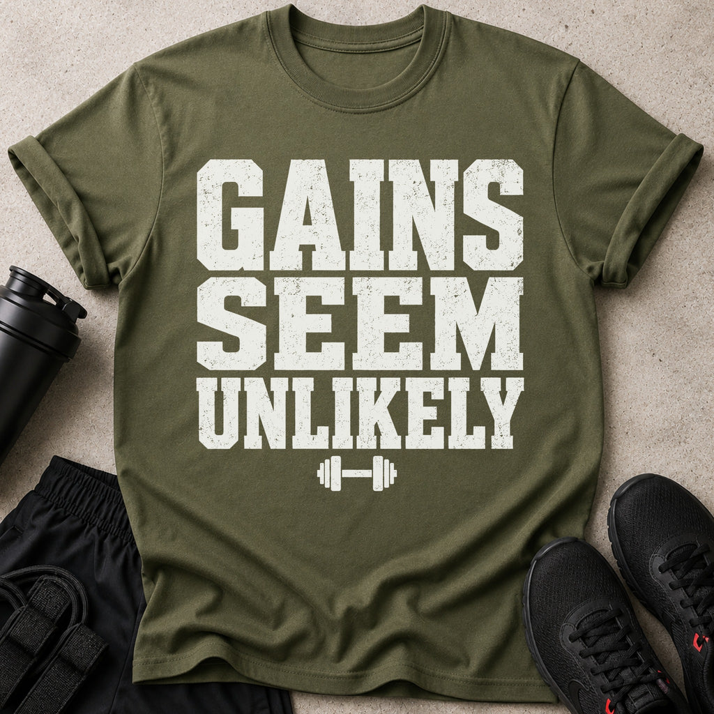 Olive green t-shirt with white text reading "GAINS SEEM UNLIKELY" with barbell graphic.