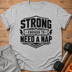 Grey t-shirt with black text: "STRONG ENOUGH TO NEED A NAP".