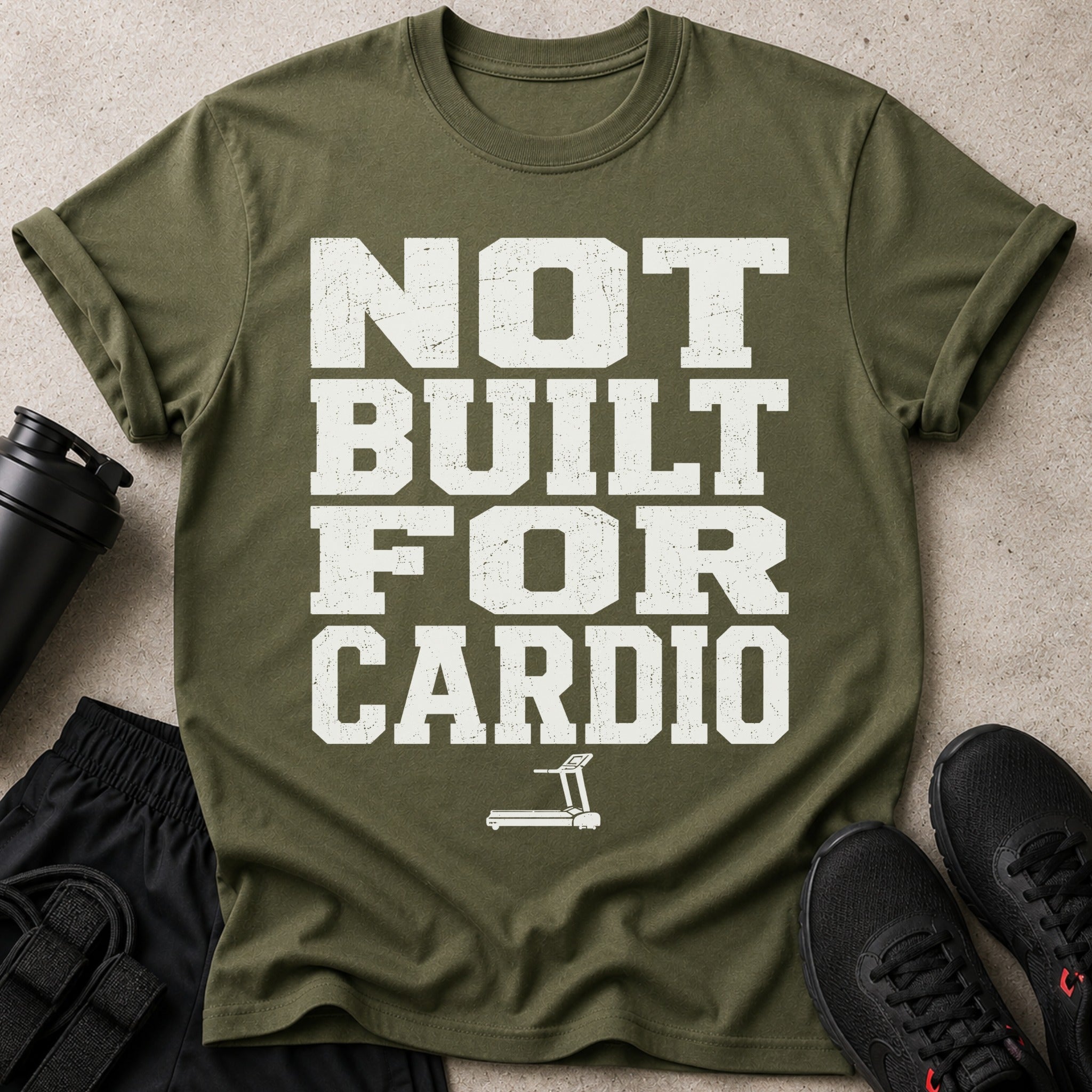 Olive green t-shirt with "NOT BUILT FOR CARDIO" text and treadmill graphic.