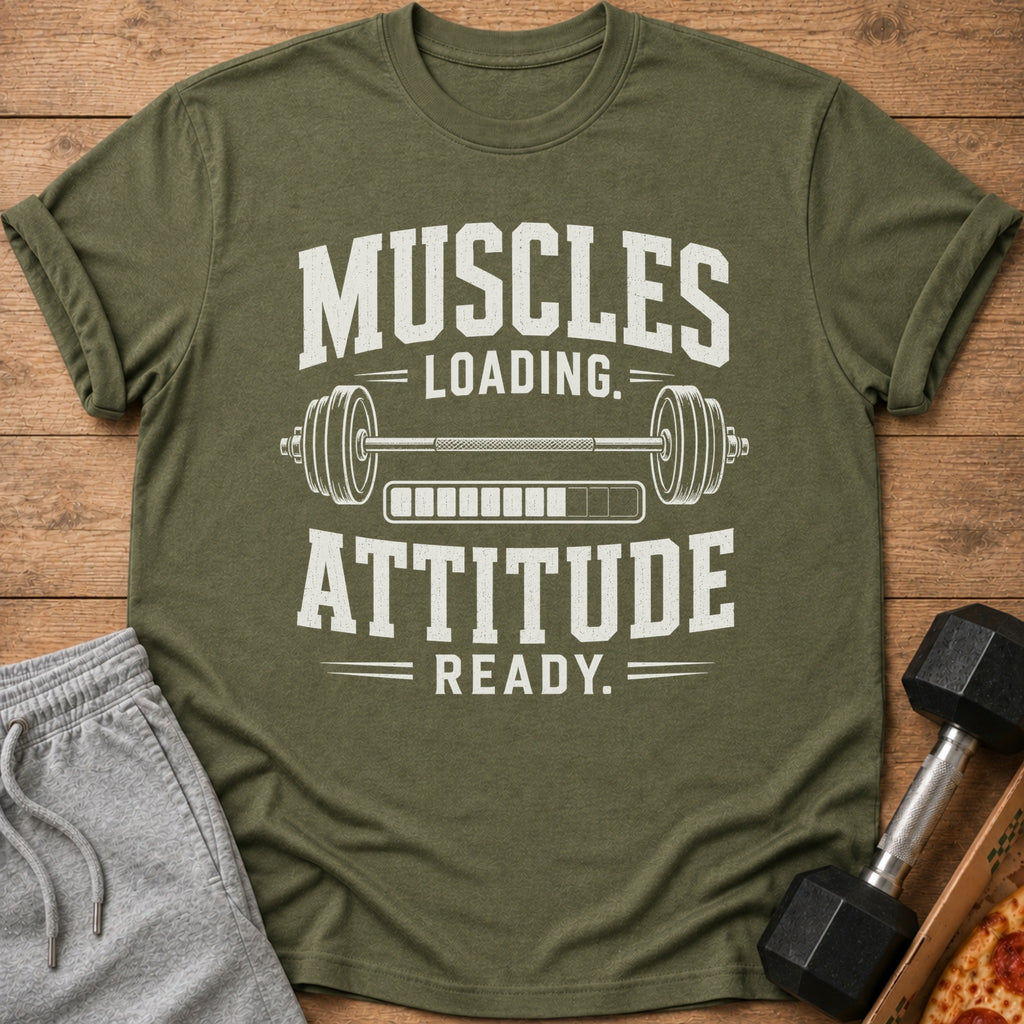 Olive green t-shirt with white text "MUSCLES LOADING. ATTITUDE READY." and barbell graphic.