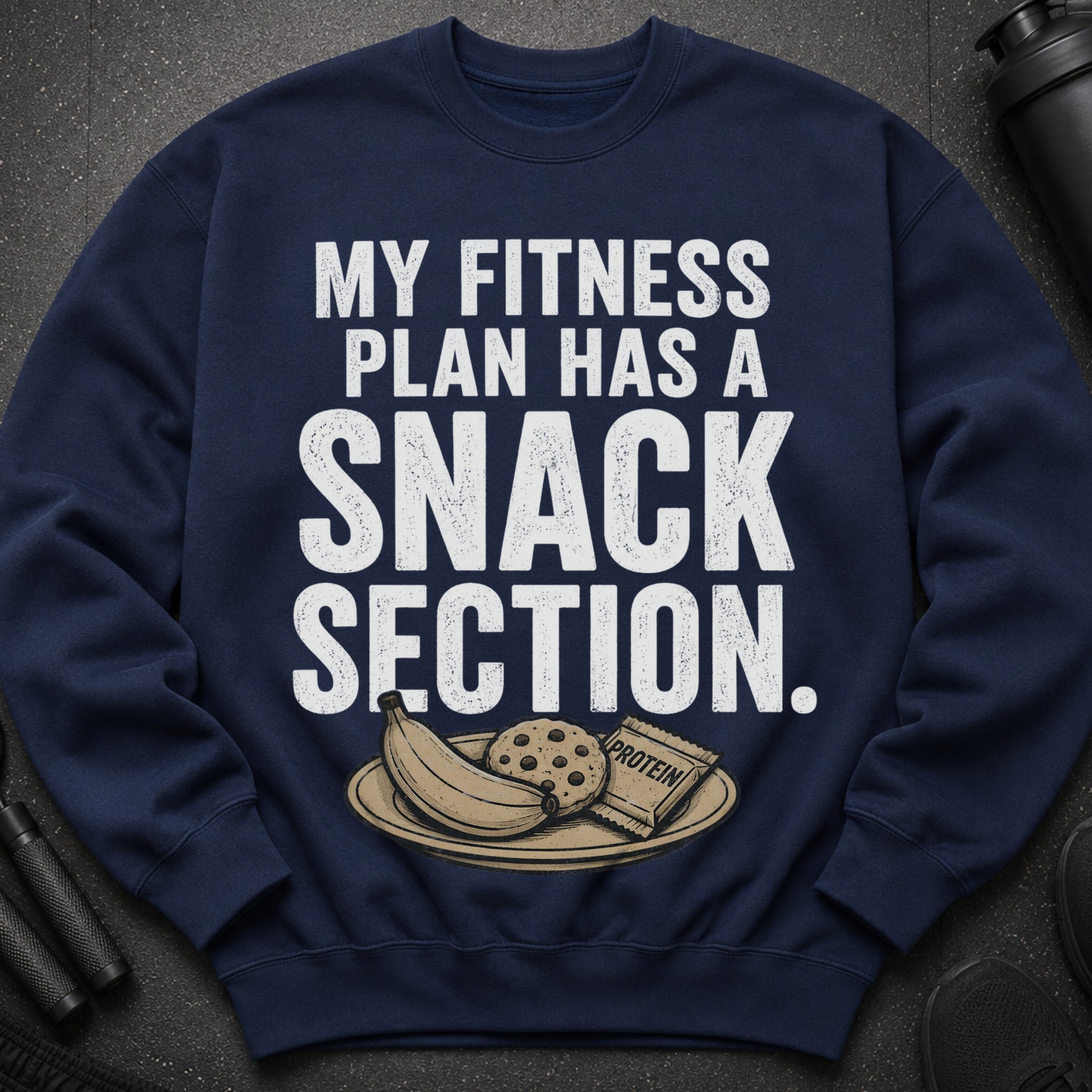 Navy sweatshirt with "MY FITNESS PLAN HAS A SNACK SECTION" text and a plate of snacks.