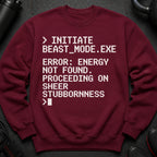 Maroon sweatshirt with white text: "INITIATE BEAST_MODE.EXE ERROR: ENERGY NOT FOUND. PROCEEDING ON SHEER STUBBORNNESS >"