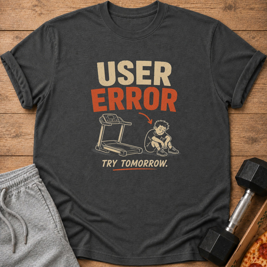 Graphic tee with "USER ERROR TRY TOMORROW" text and cartoon of a sad person by a treadmill.