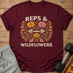 Maroon t-shirt with dumbbell and floral graphic reading "Reps & Wildflowers."