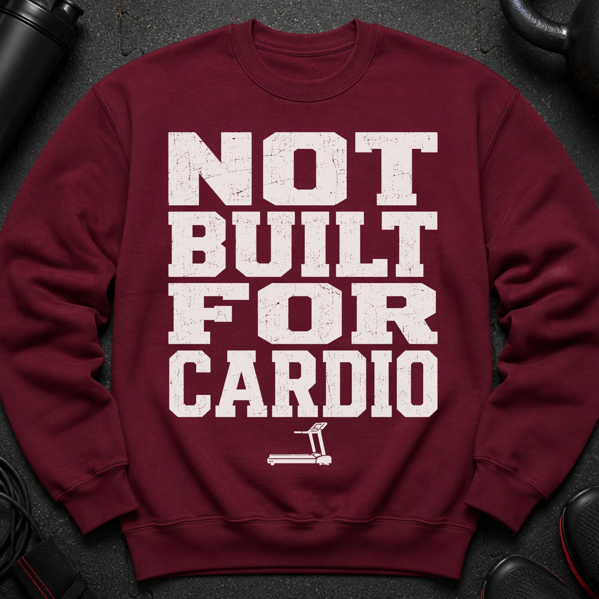 Maroon sweatshirt with "NOT BUILT FOR CARDIO" text and a treadmill graphic.