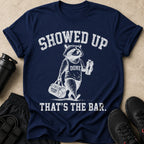 Navy t-shirt with a graphic of a raccoon in a "DONE" tank top, carrying a gym bag and shaker bottle.