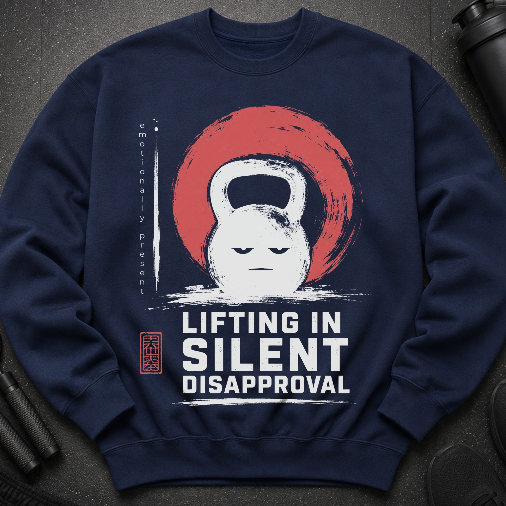 Navy sweatshirt with a grumpy kettlebell graphic and "Lifting in Silent Disapproval" text.