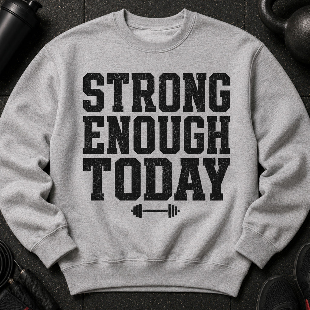 Grey sweatshirt with black distressed text "STRONG ENOUGH TODAY" and barbell graphic.